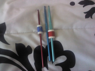 Crochet hooks, two with row counters on them.