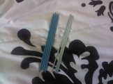 Two sets of double pointed needles.